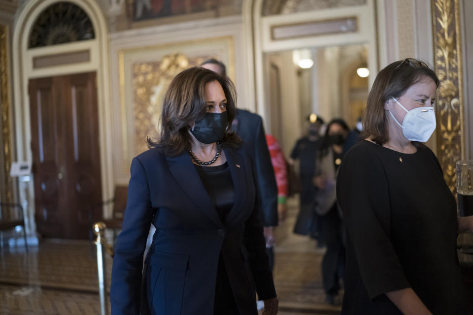 Vice President Kamala Harris arrives to break the tie on a procedural vote as the Senate works on the Democrats' $1.9 trillion COVID relief package, on Capitol Hill in Washington, Thursday, March 4, 2021. (AP Photo/J. Scott Applewhite)