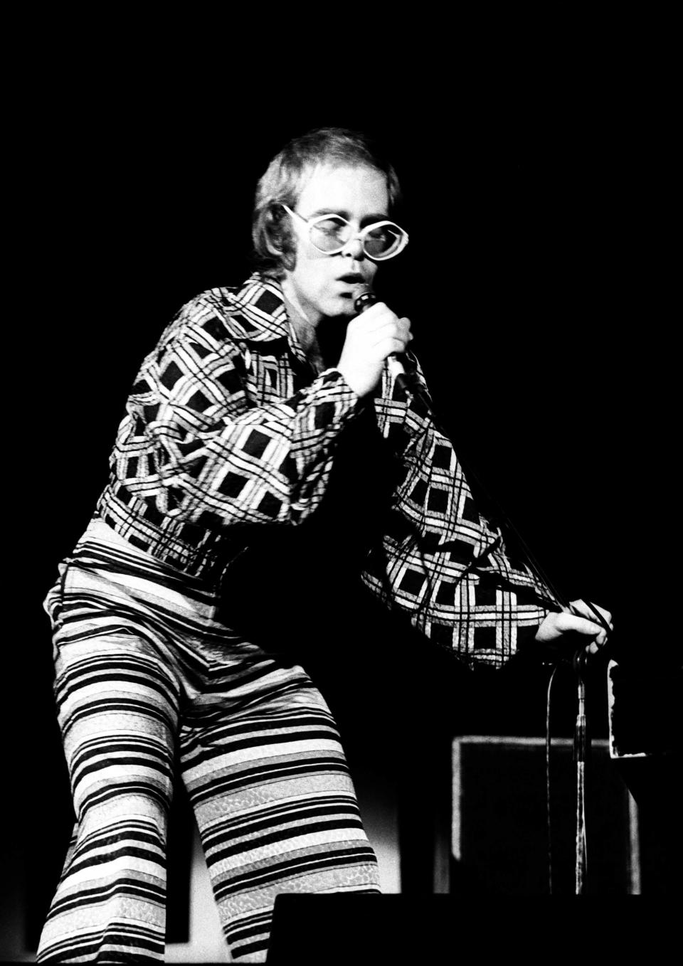 Elton John performing on stage at City Hall, Newcastle upon Tyne, United Kingdom, 07 March 1973. (Photo by Ian Dickson/Redferns)