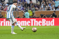 Argentina's Lionel Messi scores his side's opening goal during the World Cup final soccer match between Argentina and France at the Lusail Stadium in Lusail, Qatar, Sunday, Dec.18, 2022. (AP Photo/Manu Fernandez)