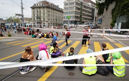 The traffic is blocked by the participants of a women's strike at the Central Square in Zurich