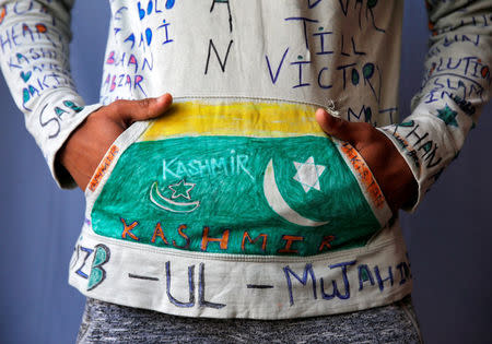 Twenty-year-old student and stone pelter, who asked to remain anonymous, poses for a portrait in Kashmir, India May 20, 2017. REUTERS/Cathal McNaughton