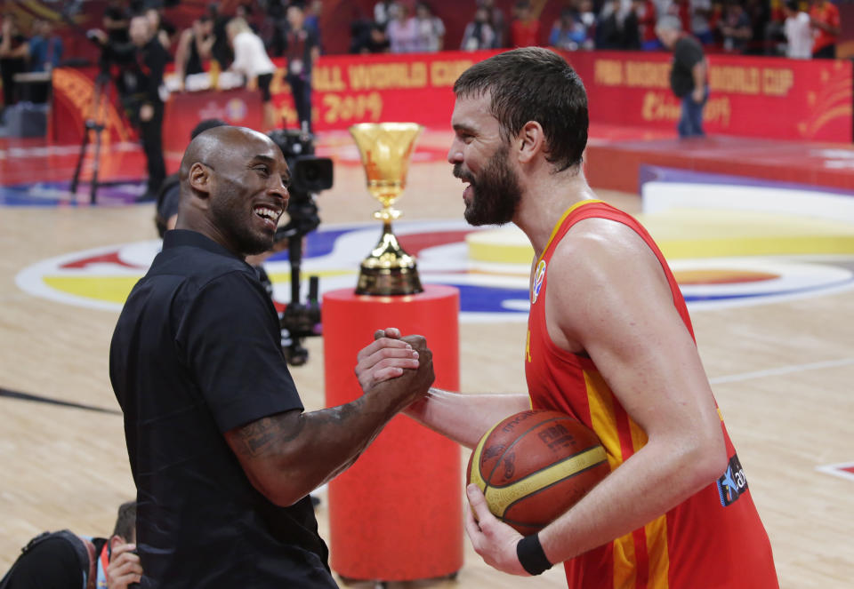 Basketball - FIBA World Cup - Final - Argentina v Spain - Wukesong Sport Arena, Beijing, China - September 15, 2019   Spain's Marc Gasol is congratulated by former basketballer Kobe Bryant after winning the FIBA World Cup REUTERS/Jason Lee