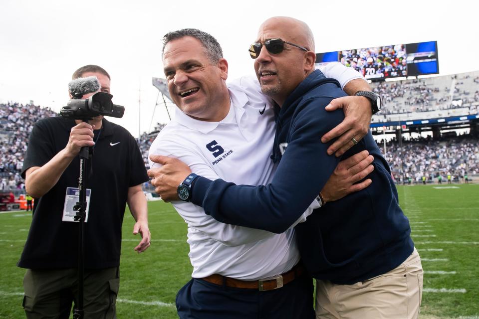 Penn State athletic director Pat Kraft gives head football coach James Franklin a big hug following a 33-24 win over Indiana at Beaver Stadium Saturday, Oct. 28, 2023, in State College, Pa.