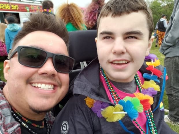 Megenbir and his former student, Rylan Moir, show off their matching moustaches at the Regina Pride festival in 2018. Megenbir said the support he received during his transition from his students and their parents was 'overwhelmingly positive.'