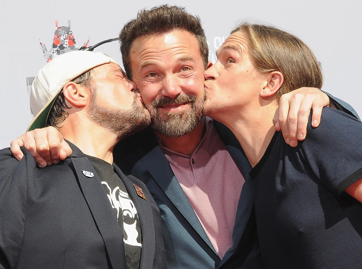 HOLLYWOOD, CA - OCTOBER 14:  Kevin Smith and Jason Mewes kiss Ben Affleck at their Hands and Footprint Ceremony held at TCL Chinese Theatre on October 14, 2019 in Hollywood, California.  (Photo by Albert L. Ortega/Getty Images)