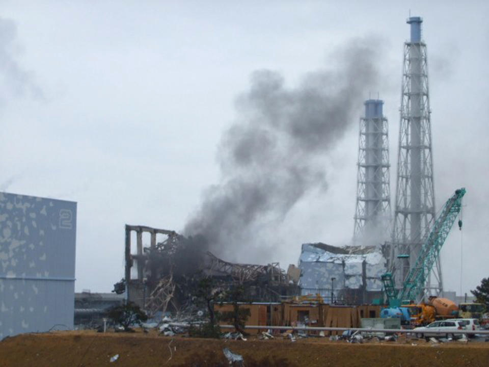 FILE - In this March 21, 2011 file photo released by Tokyo Electric Power Co. (TEPCO), smoke rises from the Unit 3 reactor of the tsunami-damaged Fukushima Dai-ichi nuclear plant in Okuma town, Fukushima prefecture, northeastern Japan. The operator of a Japanese nuclear plant that went into a tsunami-triggered meltdown knew the risks from highly radioactive water at the site but sent in crews without adequate protection or warnings, a worker said in a legal complaint filed Tuesday, Oct. 30, 2012. Asked about the allegations, a TEPCO spokesman said the plant was aware of water leaks elsewhere but couldn't anticipate the water problem in Unit 3's basement. (AP Photo/Tokyo Electric Power Co., File) EDITORIAL USE ONLY