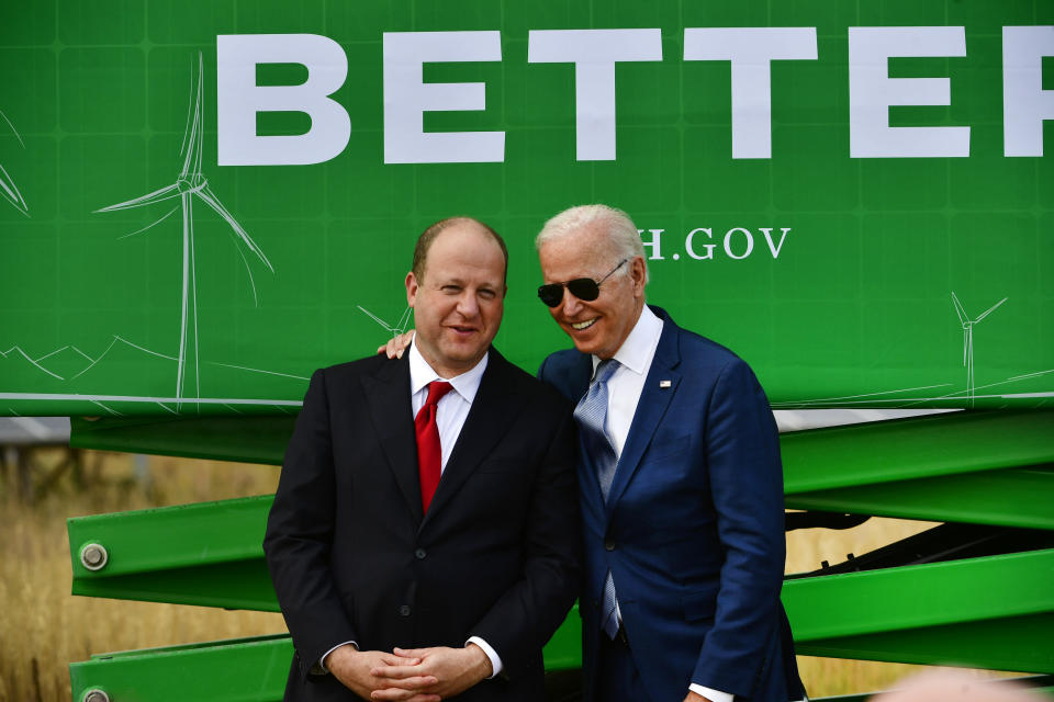 ARVADA, CO - SEPTEMBER 14: President Joe Biden, right, has a laugh with Colorado Governor Jared Polis before making remarks during a press conference on the grounds of National Renewable Energy Laboratory (NREL) on September 14, 2021 in Arvada, Colorado. Biden was in Colorado to visit NREL and to deliver remarks underscoring how the investments in his Bipartisan Infrastructure Deal and Build Back Better Agenda will help tackle the climate crisis, modernize our infrastructure and strengthen our country&#39;s resilience while creating good-paying jobs, union jobs and advancing environmental justice. (Photo by Helen H. Richardson/MediaNews Group/The Denver Post via Getty Images)