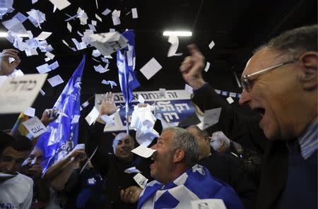 Likud party supporters react after hearing exit poll results in Tel Aviv March 17, 2015. REUTERS/Amir Cohen