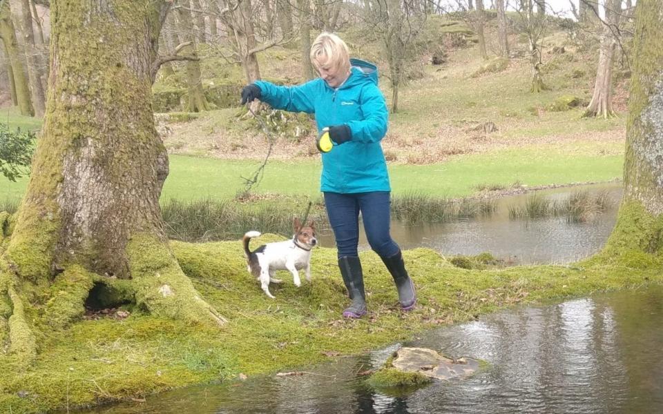 Undated handout photo issued by Kent Police of murdered PCSO Julia James walking her Jack Russell Toby - PA