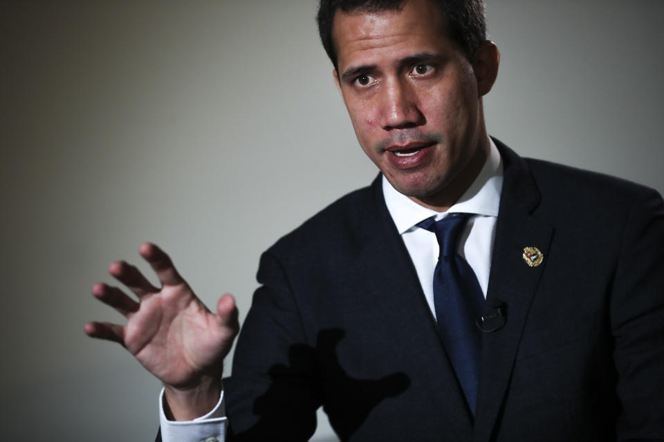 Leader of Venezuela's political opposition Juan Guaido talks to a journalist during an interview with Associated Press in Brussels, Wednesday, Jan. 22, 2020. Intelligence police raided the office of Juan Guaidó on Tuesday, while the U.S.-backed opposition leader was travelling in Europe seeking to bolster support for his campaign to oust Venezuelan President Nicolás Maduro. (AP Photo/Francisco Seco)
