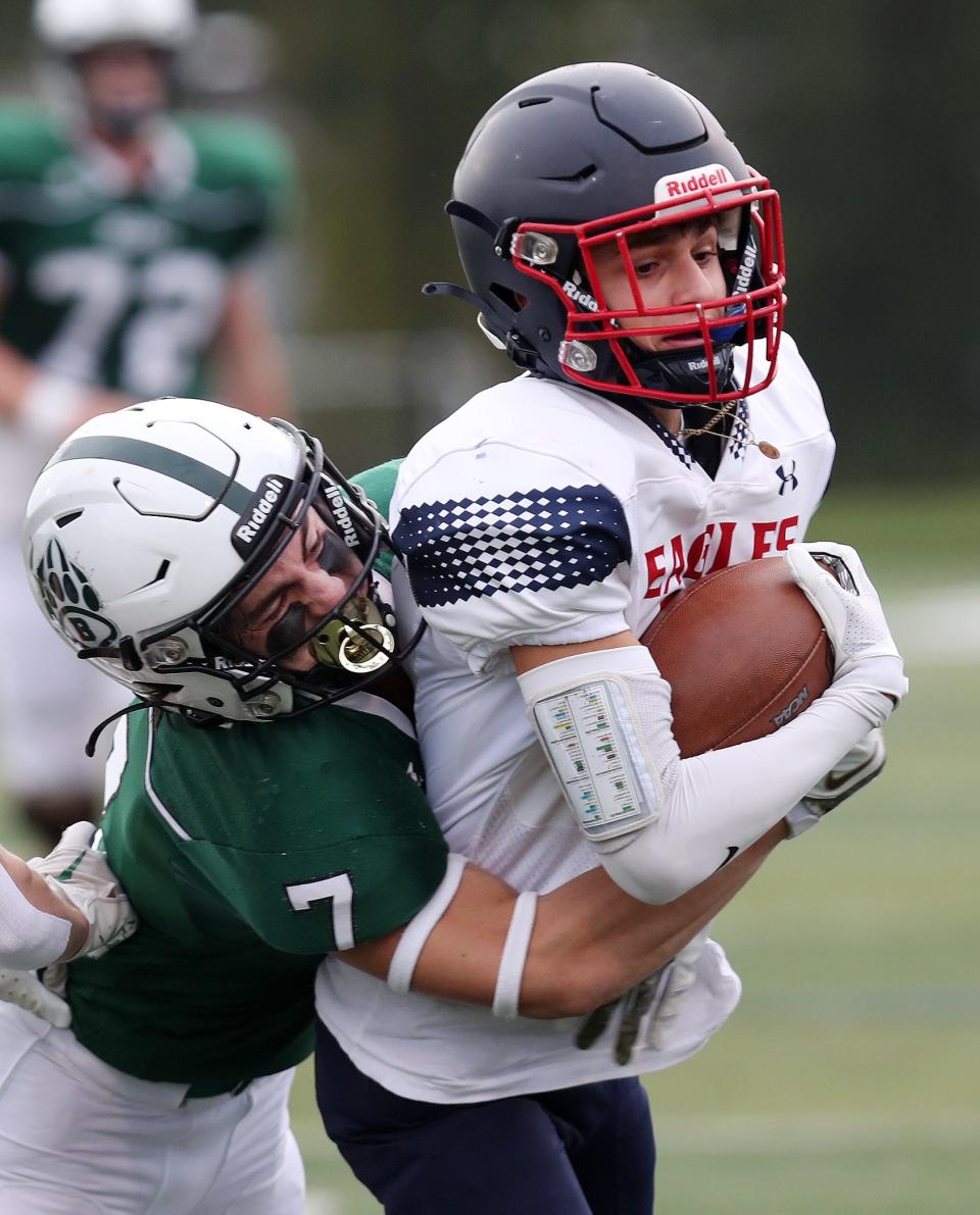 EastchesterÕs Michael Provenzale (10) tries to break away from BrewsterÕs Nick Smith (7) during football action at Brewster High School Sept. 30, 2023. Eastchester won the game 21-0. 