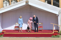 <p>President Biden held the Queen's arm as they made their way inside for afternoon tea inside the 1,000-year-old castle. </p>