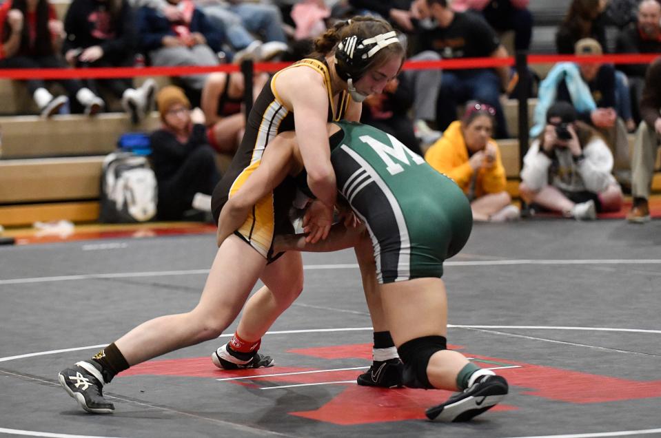 Delran's Kalli Roskos, left, defeated Mainland's Jackeline Oviedo 9-2 following Saturday's 120 lb. bout at the NJSIAA 2022 South Region girls' wrestling tournament held at Kingsway High School. Feb. 12, 2022.