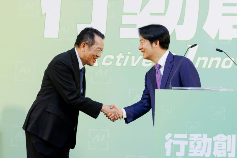 Taiwan president-elect Lai Ching-te (R) shakes hands with Wellington Koo, the island's next defence minister (Handout)