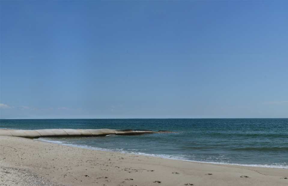 The Southeastern Wind Coalition commissioned visualizations of what the Wilmington East Wind Energy Area could look like, including this one showing the view from Bald Head Island on a clear, sunny day. The turbines are on the horizon -- white dots that you may be able to see if you enlarge the photo.