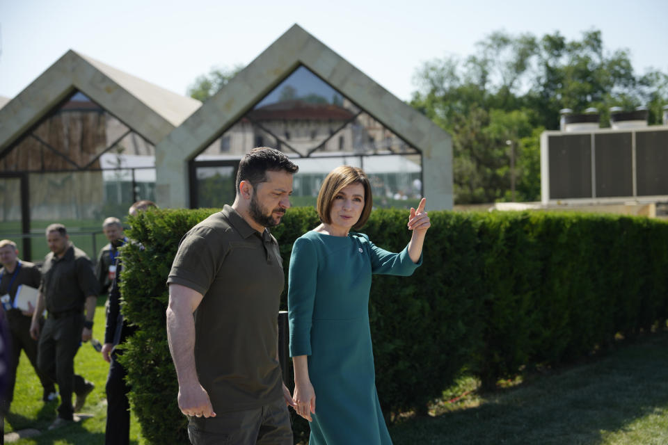 Moldova's President Maia Sandu, right, speaks with Ukraine's President Volodymyr Zelenskyy during arrivals for the European Political Community Summit at the Mimi Castle in Bulboaca, Moldova, Thursday, June 1, 2023. Leaders are meeting in Moldova Thursday for a summit aiming to show a united front in the face of Russia's war in Ukraine and underscore support for the Eastern European country's ambitions to draw closer to the West and keep Moscow at bay. (AP Photo/Andreea Alexandru)