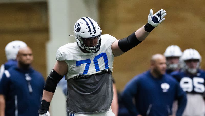 Brigham Young Cougars offensive lineman Connor Pay (70) signals a first down during spring football practice at the Indoor Practice Facility in Provo on March 10, 2023.