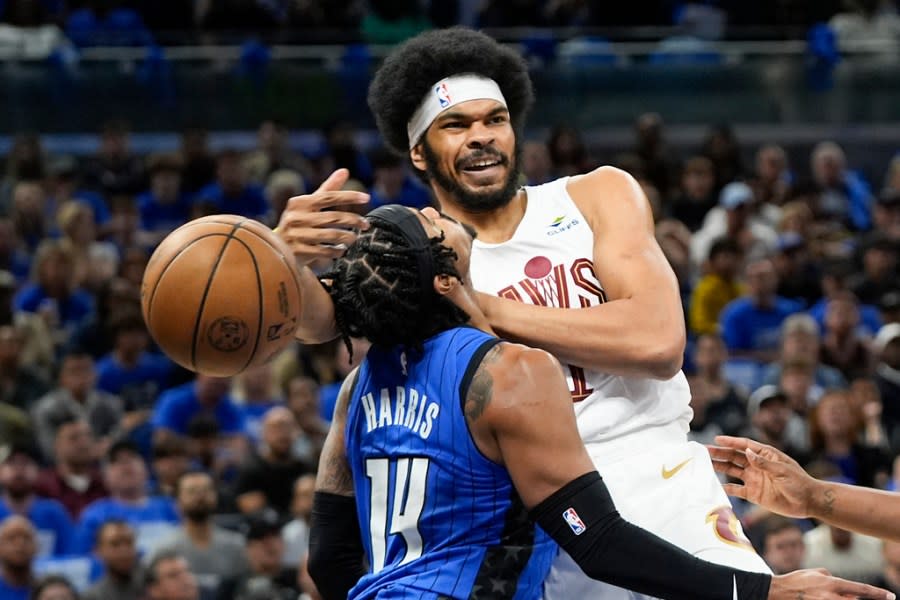 Cleveland Cavaliers center <a class="link " href="https://sports.yahoo.com/nba/players/5835/" data-i13n="sec:content-canvas;subsec:anchor_text;elm:context_link" data-ylk="slk:Jarrett Allen;sec:content-canvas;subsec:anchor_text;elm:context_link;itc:0">Jarrett Allen</a>, right, is fouled by Orlando Magic guard <a class="link " href="https://sports.yahoo.com/nba/players/5330/" data-i13n="sec:content-canvas;subsec:anchor_text;elm:context_link" data-ylk="slk:Gary Harris;sec:content-canvas;subsec:anchor_text;elm:context_link;itc:0">Gary Harris</a> (14) as he tries to pass the ball during the first half of Game 4 of an NBA basketball first-round playoff series, Saturday, April 27, 2024, in Orlando, Fla. (AP Photo/John Raoux)