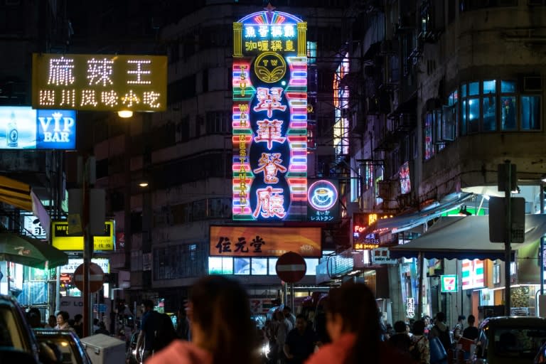 Neon has come to define the urban landscape in Hong Kong, with huge flashing signs protruding horizontally from the sides of buildings