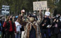 Hospitality workers protest in Parliament Square in London, Monday, Oct. 19, 2020. Hospitality workers are demonstrating outside Parliament against tougher coronavirus restrictions and the amount of financial support given by the government to the industry.(AP Photo/Frank Augstein)