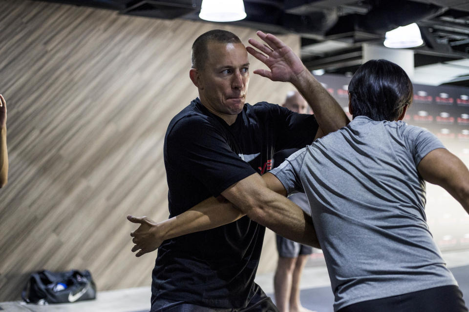 Retired mixed martial arts superstar Georges St-Pierre conducting an MMA seminar at the Evolve MMA Academy at Far East Square on 9 March 2019. (PHOTO: Evolve MMA)