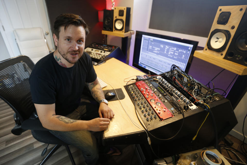 In this Sept. 30, 2019 photo, Andreas Magnusson, a music producer who has been in the US for over 30 years, poses in his studio in Richmond, Va. Magnusson is among the oldest immigrants enrolled in Deferred Action for Childhood Arrivals, known as DACA. He came to the U.S. from Sweden when he was a toddler. His mother had a student visa and eventually found an employer who was sponsoring the two, but an immigration lawyer botched their case, and Magnusson, already an adult with a growing business, a home and a car, was left without legal status. (AP Photo/Steve Helber)