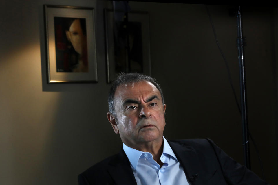 Former Nissan executive Carlos Ghosn speaks during an interview with The Associated Press, in Dbayeh, north of Beirut, Lebanon, Tuesday, May 25, 2021. The embattled former chairman of the Renault-Nissan-Mitsubishi alliance dissected his legal troubles in Japan, France and the Netherlands, detailed how he plotted his brazen escape from Osaka, and reflected on his new reality in crisis-hit Lebanon, where he is stuck for the foreseeable future. (AP Photo/Hussein Malla)