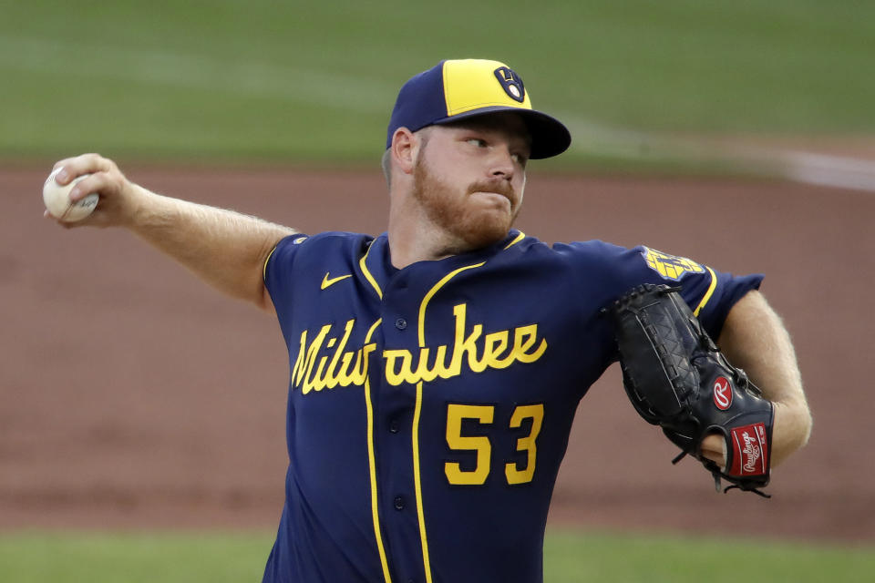 Milwaukee Brewers starting pitcher Brandon Woodruff delivers during the first inning of a baseball game against the Pittsburgh Pirates in Pittsburgh, Wednesday, July 29, 2020. (AP Photo/Gene J. Puskar)