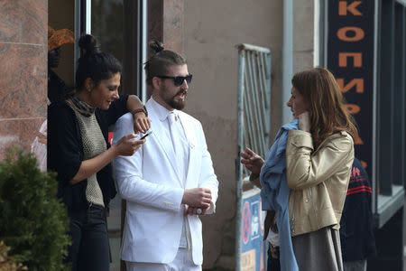 Student and 2017 presidential candidate Luka Maksimovic, 25, talks to locals as his alter ego 'Ljubisa "Beli" Preletacevic' a parody of the worst politician in the Balkans, in the town of Mladenovac, Serbia, March 20, 2017. Picture taken March 20. REUTERS/Djordje Kojadinovic