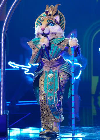 <p>Michael Becker / FOX</p> Miss Cleocatra performing on 'The Masked Singer' season 11