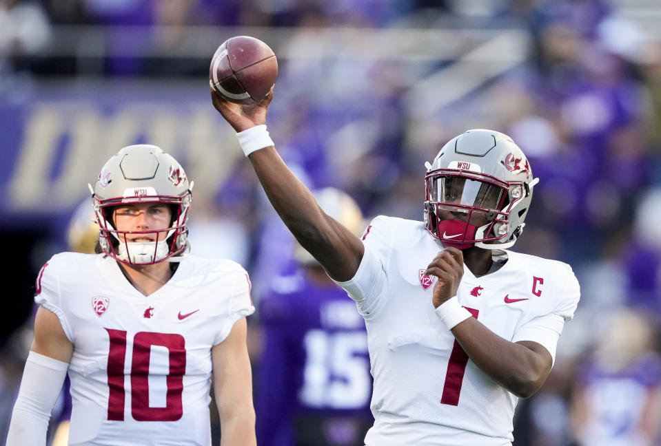 Washington State quarterback Cameron Ward (1) throws during warmups before an NCAA college football game against Washington, Saturday, Nov. 25, 2023, in Seattle. (AP Photo/Lindsey Wasson)