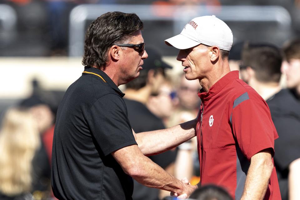 Oklahoma State coach Mike Gundy and Oklahoma coach Brent Venables meet before a game Saturday, Nov. 4, 2023, in Stillwater, Okla. | Mitch Alcala, Associated Press