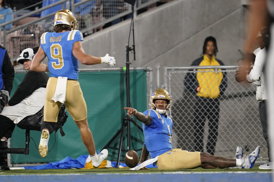 UCLA quarterback Dorian Thompson-Robinson (1) celebrates with wide receiver Jake Bobo (9) after scoring a touchdown during the first half of an NCAA college football game against Stanford in Pasadena, Calif., Saturday, Oct. 29, 2022. (AP Photo/Ashley Landis)