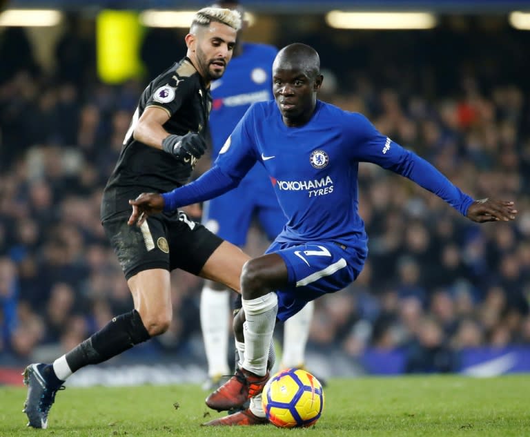 Chelsea's N'Golo Kante (R) turns away from Leicester City midfielder Riyad Mahrez (L) during their Premier League match at London's Stamford Bridge