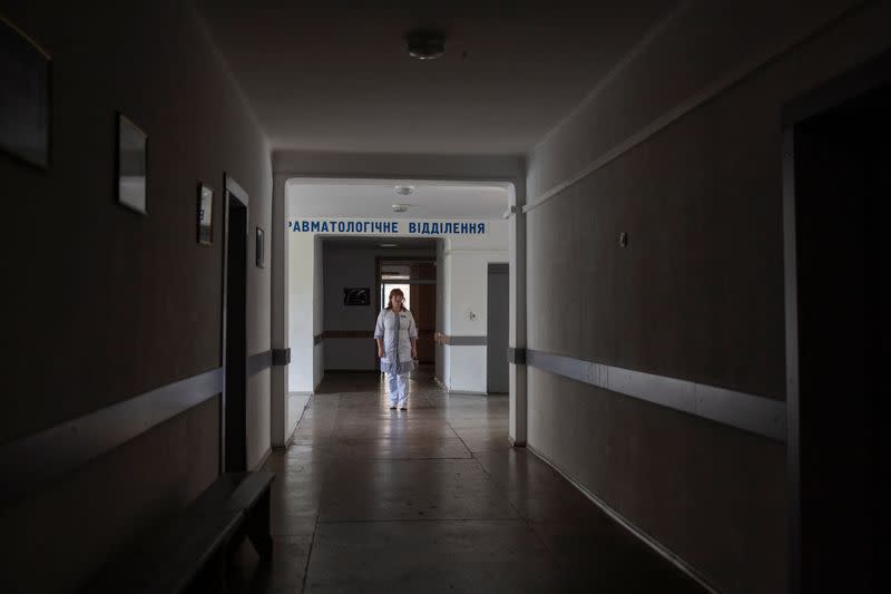 Therapeutist Olena Belinska stands in a corridor of a local hospital, which was used by Russian troops as a hosting place during occupation of the Balakliia town