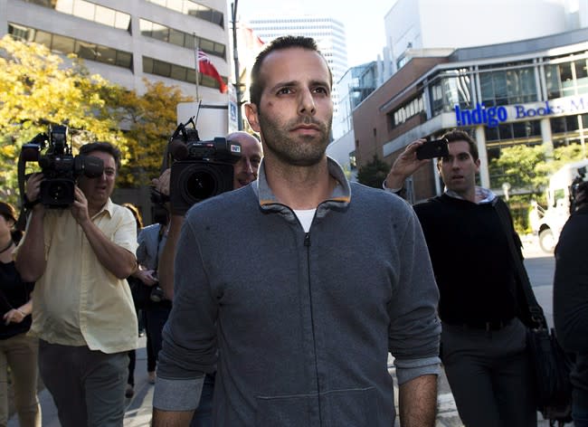 Alexander Lisi leaves Old City Hall court after being granted bail in Toronto on Wednesday, Oct. 2, 2013. THE CANADIAN PRESS/Nathan Denette