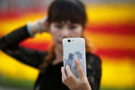 <p>A woman takes pictures of herself as people gather in Tiananmen Square to celebrate National Day marking the 67th anniversary of the founding of the People’s Republic of China, in Beijing October 1, 2016. (REUTERS/Damir Sagolj) </p>