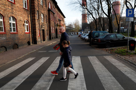 Miner Krzysztof Zawisza, 32, brings his daughter Julia, 6, home from kindergarten in Nikiszowiec district in Katowice, Poland, November 8, 2018. REUTERS/Kacper Pempel