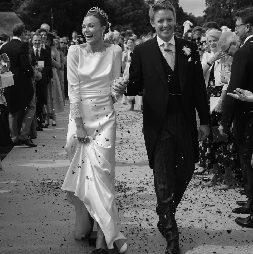 The Duke and Duchess of Westminster are pictured in what appears to be confetti