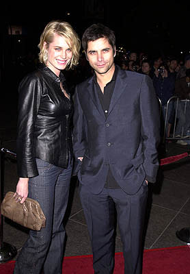 Rebecca Romijn Stamos with hubby John Stamos at the Los Angeles premiere of Guy Ritchie 's Snatch (1/18/2001) Photo by Steve Granitz/WireImage.com