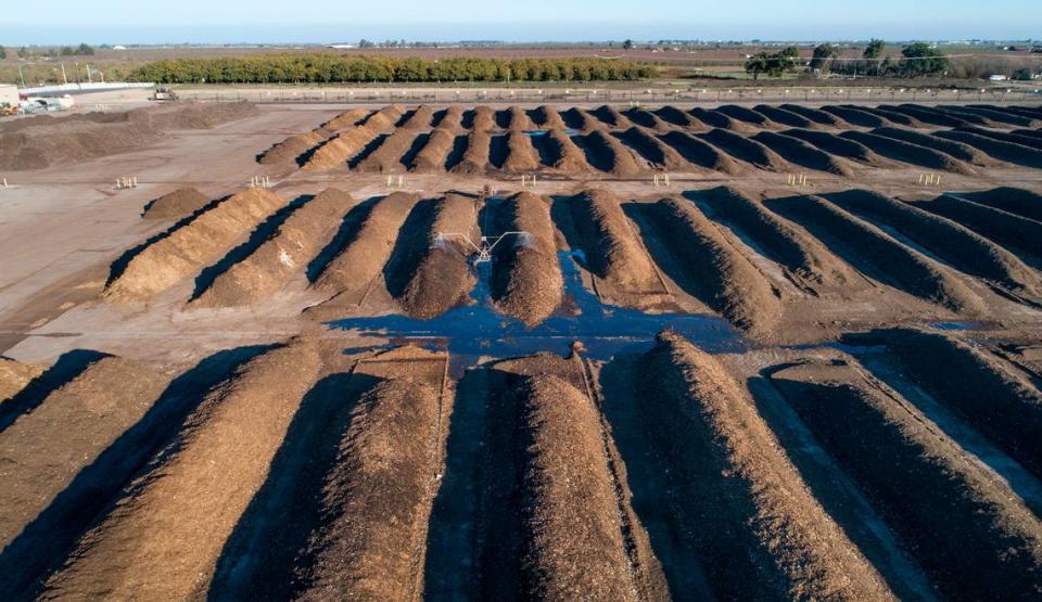 Rows of organic material breaks down as part of the composting process at the City of Modesto Compost Facility west of Modesto, Calif., on Wednesday, Nov. 17, 2021.