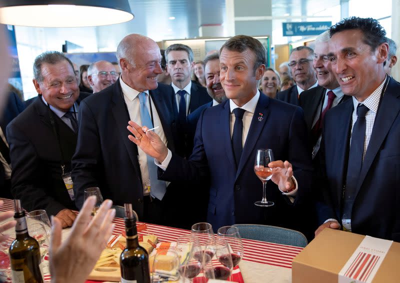 FILE PHOTO: French President Macron tours the exhibition hall above the international press center on the opening day of the G7 summit, in Anglet