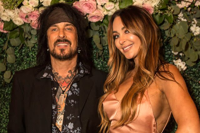 <p>Harmony Gerber/Getty</p> Nikki Sixx and Courtney Sixx in 2018