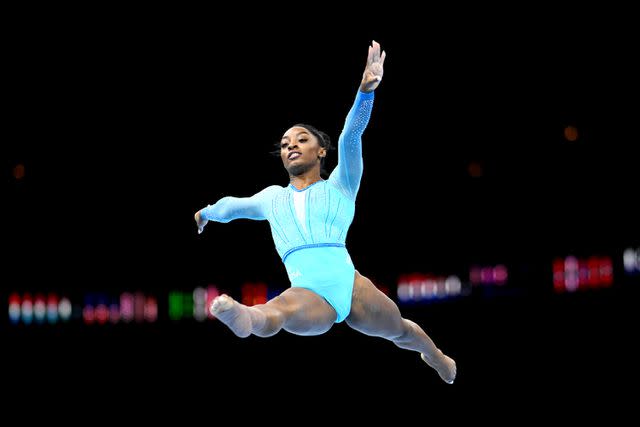 <p>Matthias Hangst/Getty</p> Simone Biles of Team United States competes on Floor Exercise during Women's Qualifications on Day Two of the FIG Artistic Gymnastics World Championships in Antwerp, Belgium