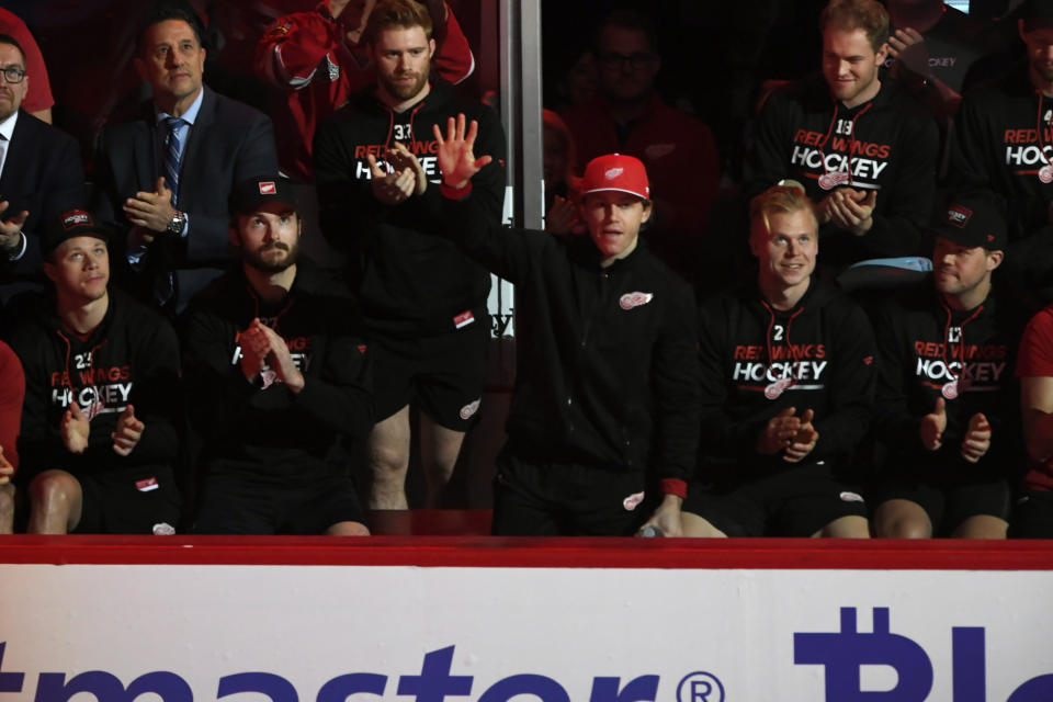 Former Chicago Blackhawks player and current Detroit Red Wings player Patrick Kane waves to the crowd during former Chicago Blackhawks great Chris Chelios' ceremony to retire his jersey before an NHL hockey game between the Chicago Blackhawks and Detroit Redwings Sunday, Feb. 25, 2024, in Chicago. (AP Photo/Paul Beaty)