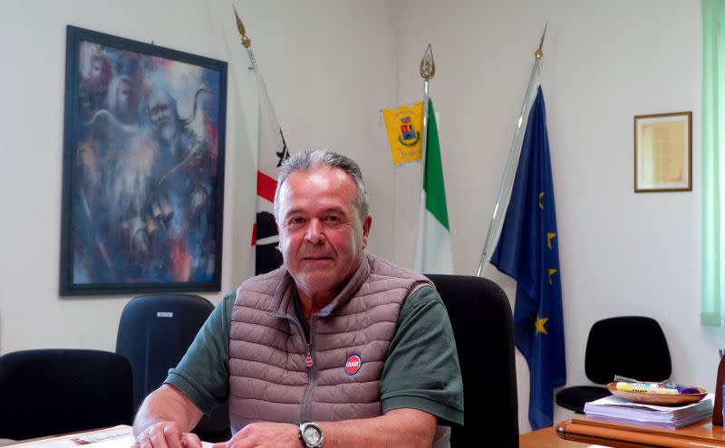 Lula's Mayor Mario Calia poses for a picture inside his office ahead of an interview with Reuters in Lula