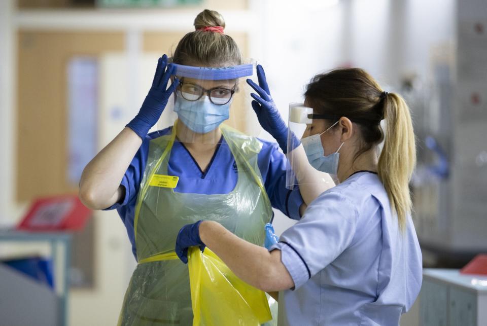 <p>A nurse wearing protective equipment during the Covid pandemic</p> (PA)