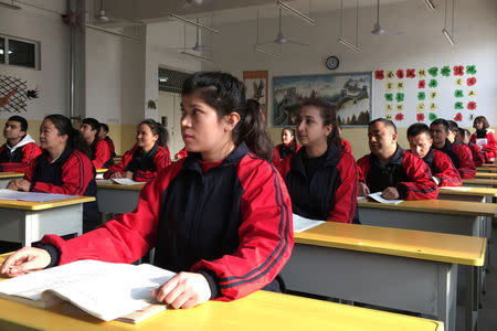 Residents at the Kashgar city vocational educational training centre attend a Chinese lesson during a government organised visit in Kashgar, Xinjiang Uighur Autonomous Region, China, January 4, 2019. PREUTERS/Ben Blanchard