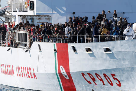 Migrants arrive by the Italian coastguard vessel Peluso in the Sicilian harbour of Augusta, Italy, May 13, 2016. REUTERS/Antonio Parrinello