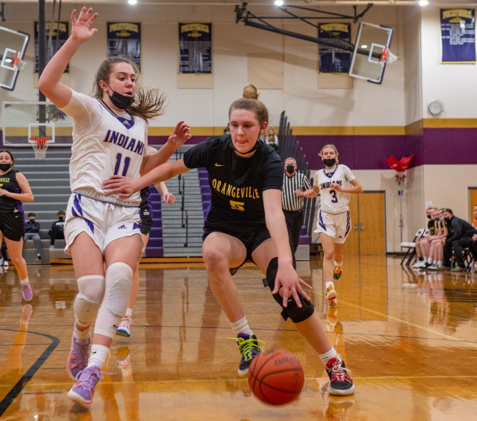 Orangeville junior Whitney Sullivan, shown driving against Pecatonica on Jan. 22, 2022, is a 6-foot-3 wing whose varied skills have earned her a scholarship offer from Wisconsin.